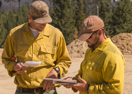 photo of ordm reviewing paperwork with team member