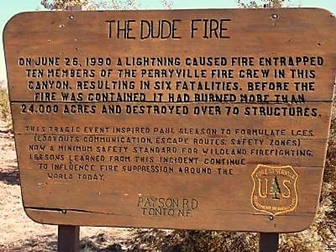 Monument memorial wooden sign describing the Dude Fire incident.