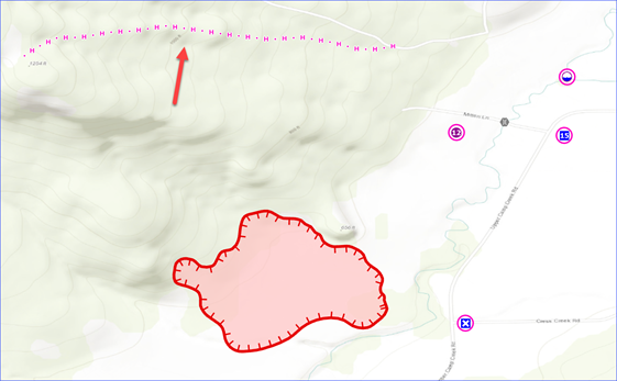 Planned handline highlighted along a ridge north of a fire perimeter.