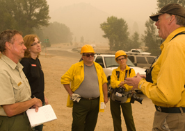 photo of iarr talking with a group of firefighters and managers