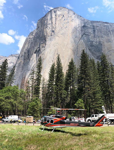 Photo of El Capitan with a temporary helibase located in foreground. Decorative.