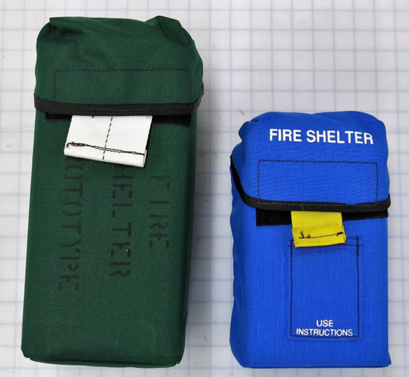 Two shelter carriers side-by-side, one green, the other blue.