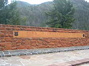 The firefighter memorial is easily located along side Highway 14/16/20. It was built by the CCCs and dedicated in 1938. There is a large paved turnout here and a Forest Service parking area below the roadside turnout. The road turn-off to Blackwater Canyon is just east of the memorial site.