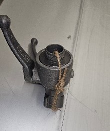 Wye, gated valve body with jute through it and tied.