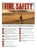 Firefighter looking at a grass fire with fire prevention tips.