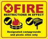 Fire restrictions with red x; campfire in fire ring at developed site with OK checkmark; pedestal grill at developed site with OK checkmark; "Designated campgrounds and picnic sites only" text
