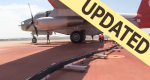 Picture of an airtanker on the RAMP getting refilled with retardant with updated banner.