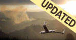 Photo of a drone flying over mountains toward a area of smoke.