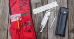 Photo of a complete belt weather kit laid out on a table.
