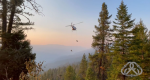 Helicopter in the distance with rappelers.
